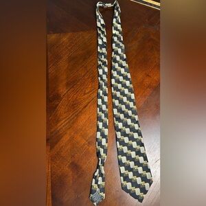 Versace Black and Gold Checkered Tie It has a small detail